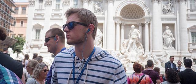 Male student in front of the Trevi fountain