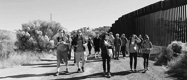 students walking along a border
